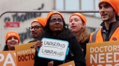 Don’t put off treatment during doctors’ strike, NHS tells patients