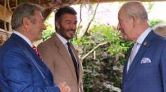 King all smiles as he meets David Beckham at Chelsea Flower Show