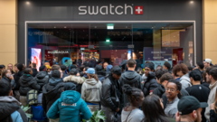Massive queues shut Swatch stores as hundreds clamour for £335 limited edition watch