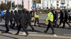 Use all powers necessary on anti-migrant protests, home secretary tells police